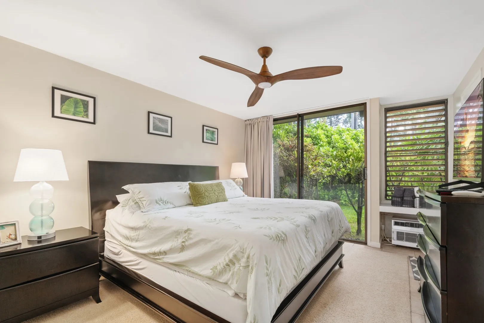 In-unit washer and dryer behind louvered doors at North Shore Oahu vacation rental