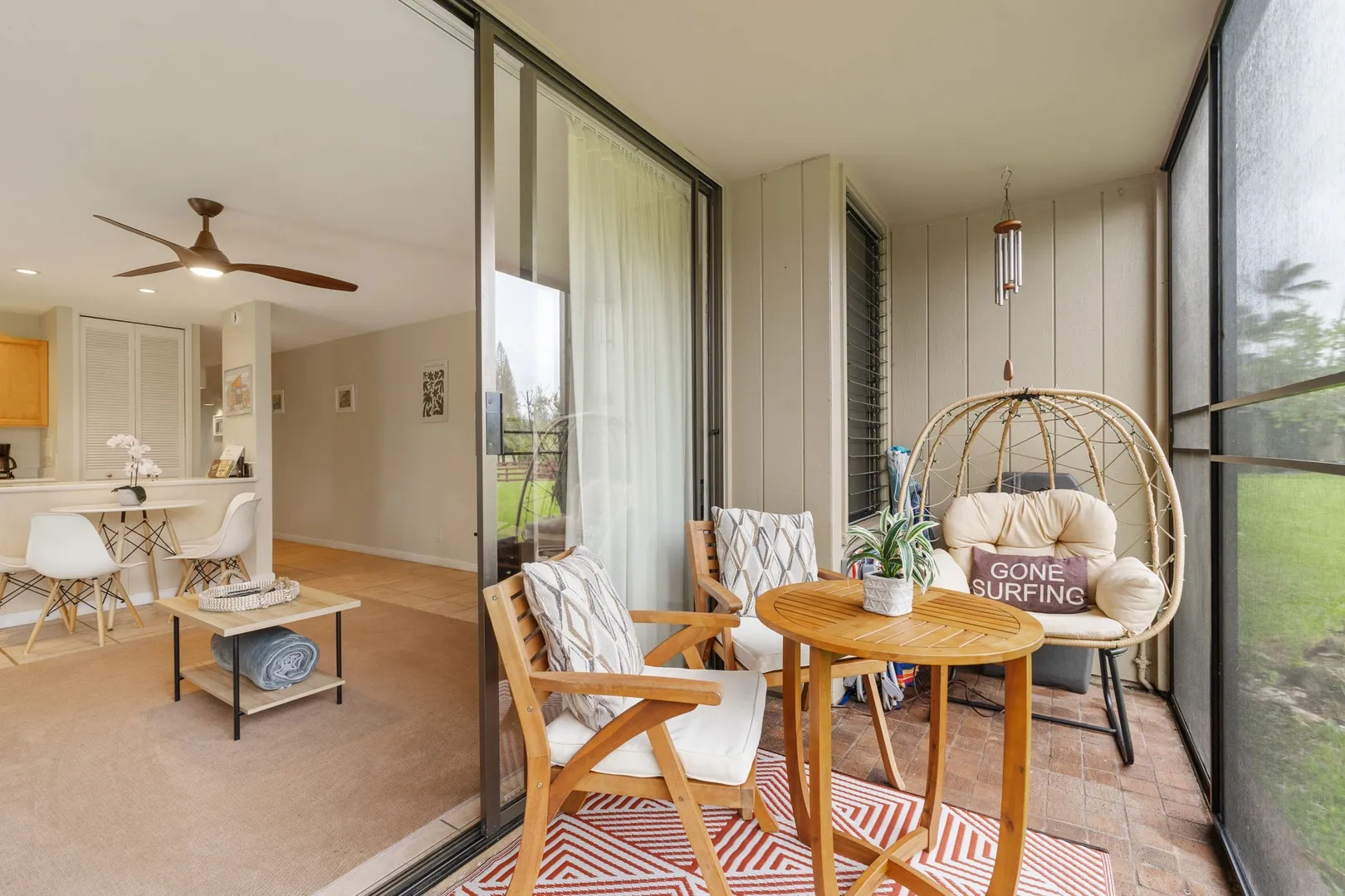 Open-concept kitchen and dining area with coastal decor at North Shore Oahu condo